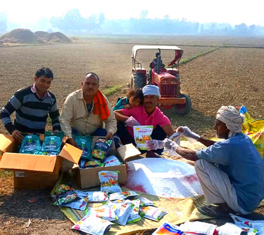 Farmers with DeHaat's agri input products